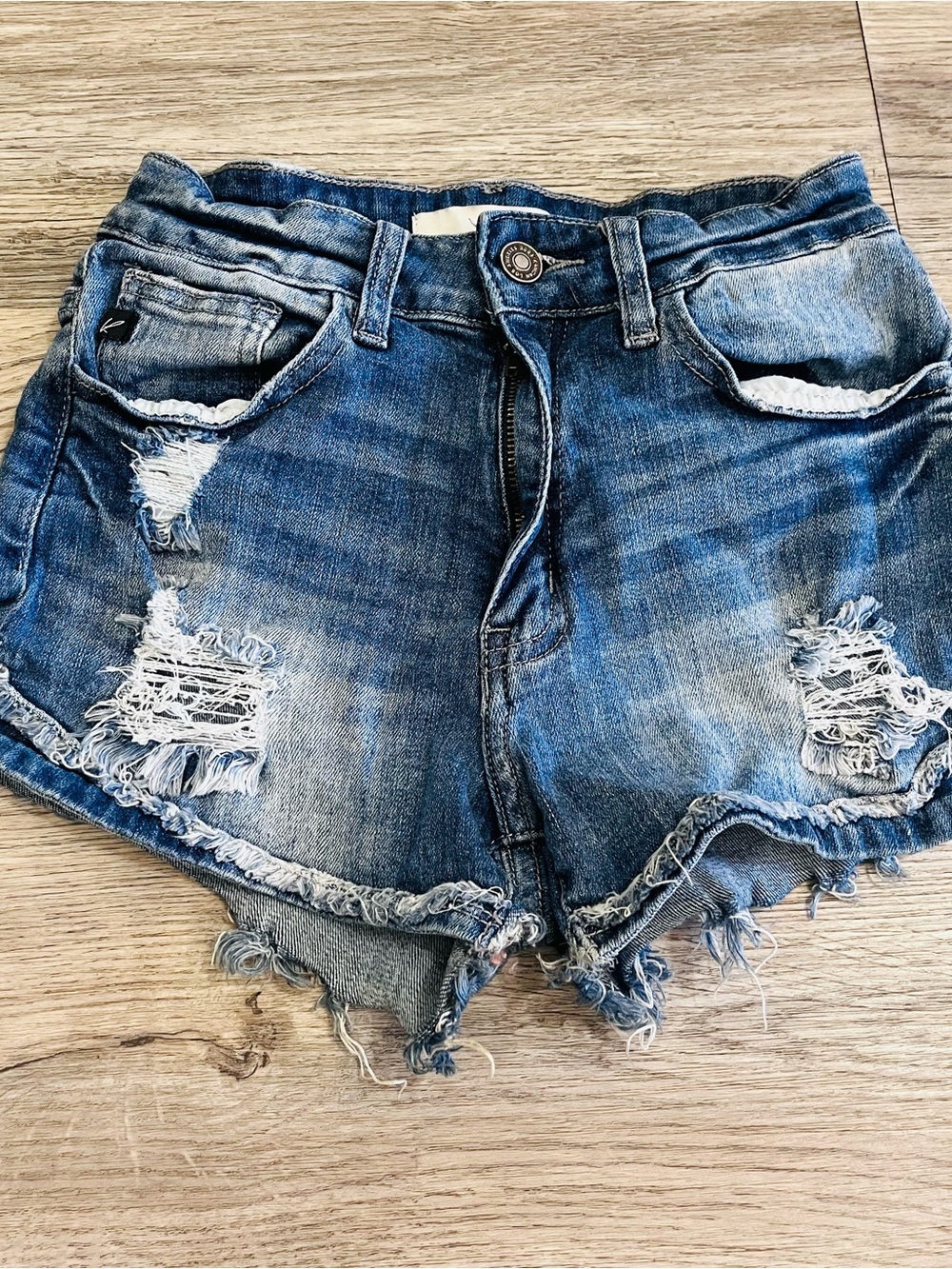 KanCan Women's Distressed Blue Denim Shorts with Frayed Hem
